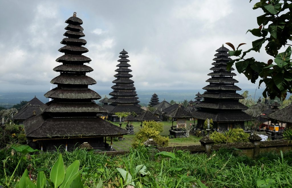 A captivating view of the iconic Besakih Temple in Bali under a cloudy sky.