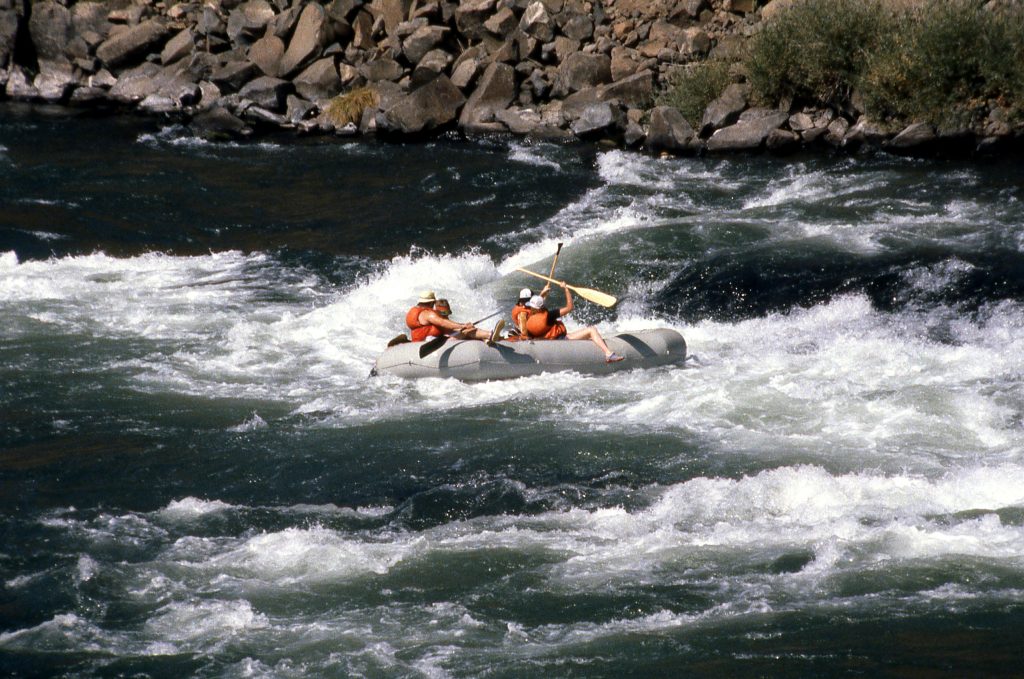Thrilling whitewater rafting on a scenic Oregon river, perfect for adventure seekers and nature lovers.